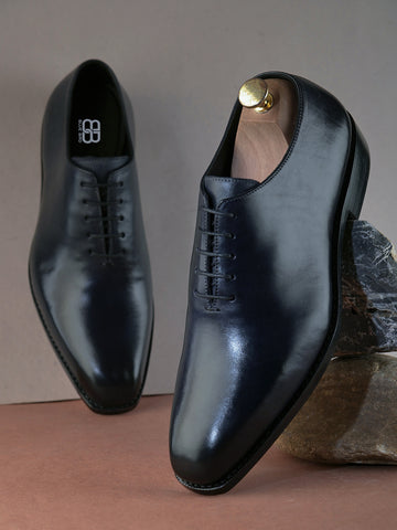 Black Whole Cut Leather Oxfords